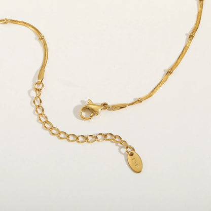 Armband mit Schlangenkugel-Perlenkette im Lagenlook