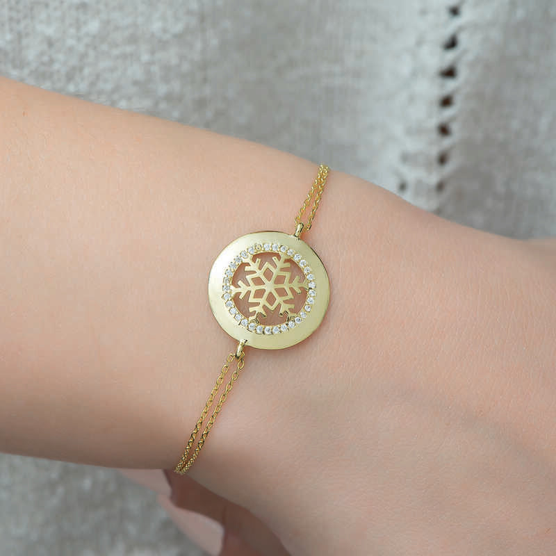 Bracelet en argent plaqué or pour femme avec flocon de neige