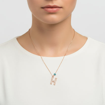 Collier en argent pour femme avec lettre H et rose mauvais œil