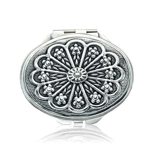 Miroir à main ovale argenté recouvert de motifs de marguerites