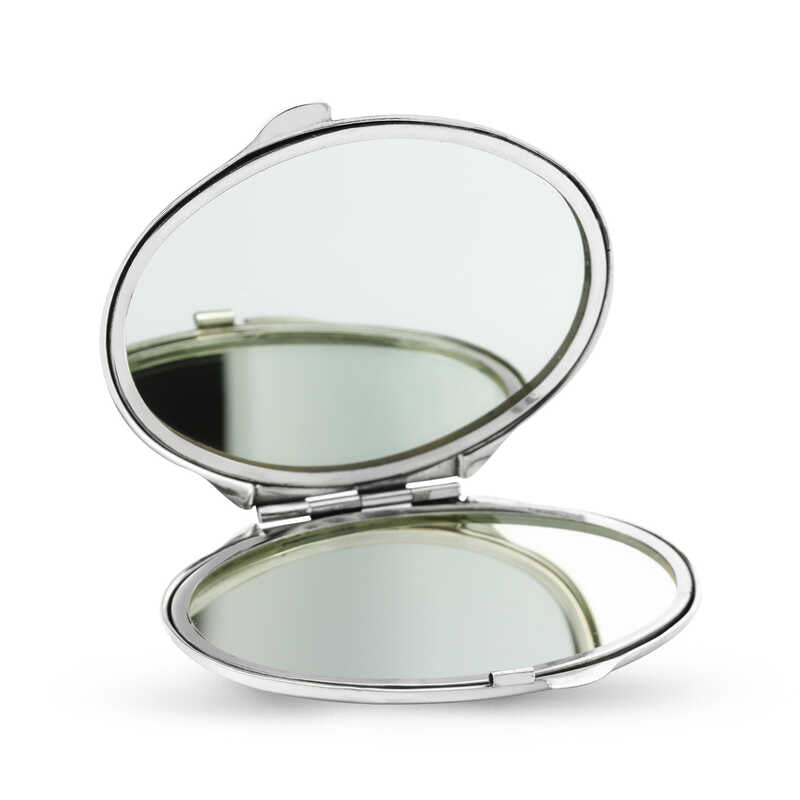 Miroir à main ovale argenté recouvert de motifs de marguerites
