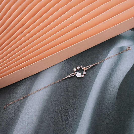 Rosévergoldetes Damen-Silberarmband mit Magnolienblüte und Schmetterling