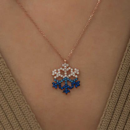 Collier en argent plaqué rose avec flocon de neige en pierre bleue